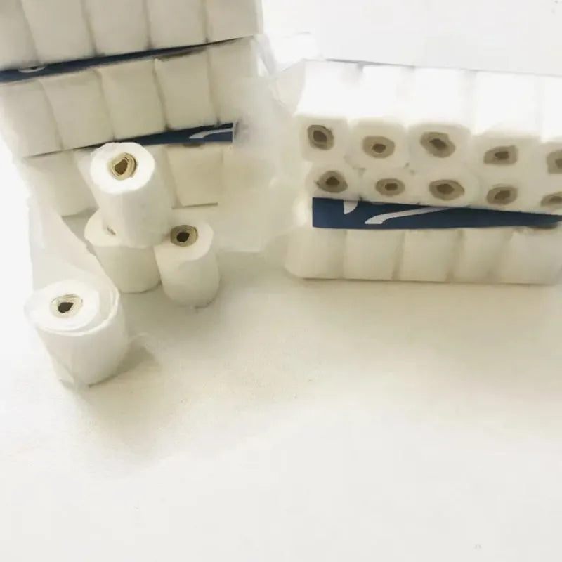 Miniature simulated toilet paper roll toy model for dollhouses, made of paper.