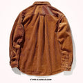 A caramel coloured corduroy loose shirt with long sleeves, shown in a cardigan style.