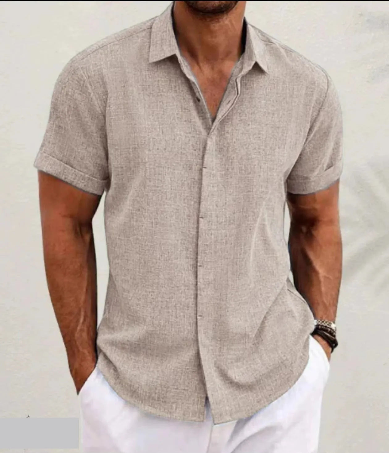 Men's light grey loose-fit cotton blend cardigan with a lapels collar and long sleeves laid flat.