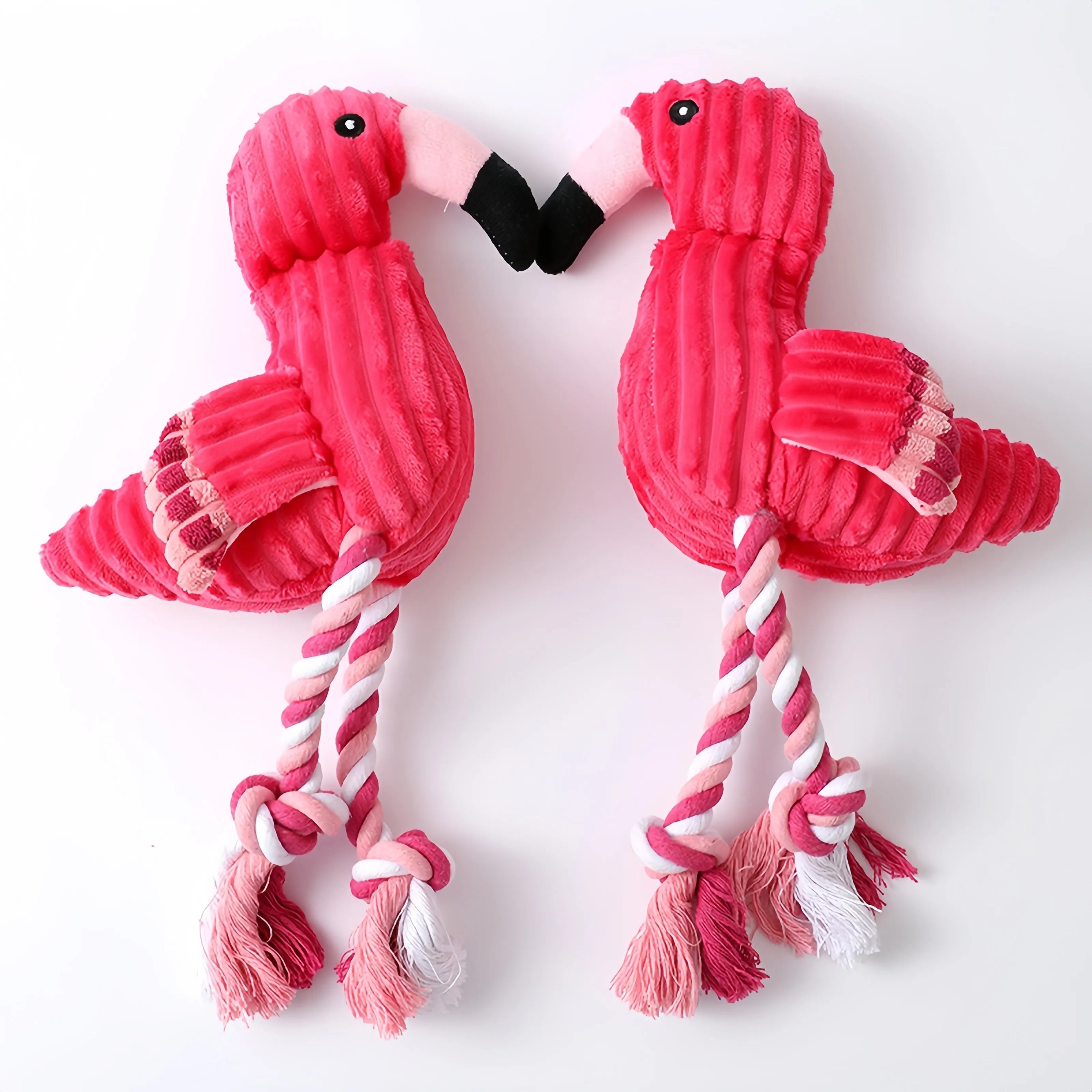Pink animal-shaped corduroy plush dog squeaky toy for chewing play.