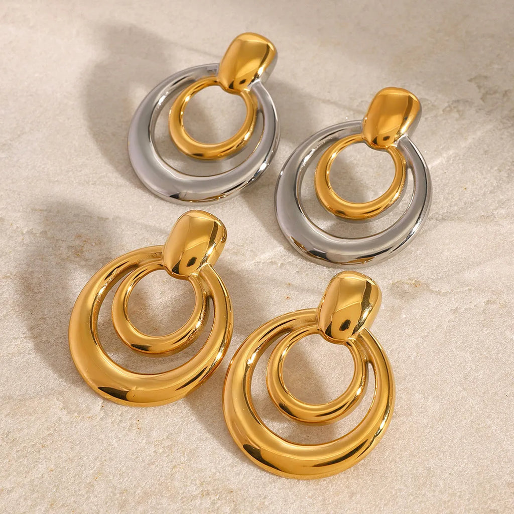 Gold geometric round stud earrings with double-layer hollow design on titanium steel posts