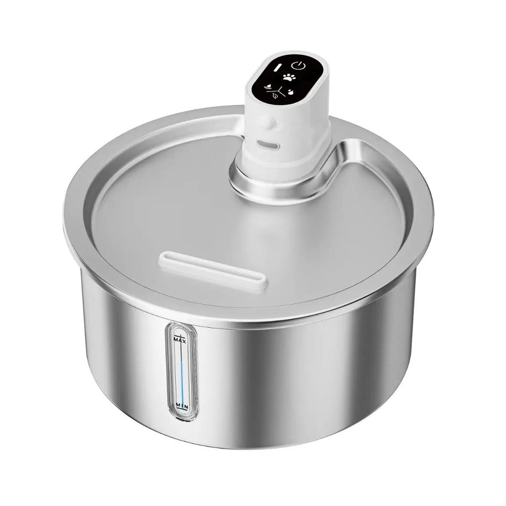 Stainless steel pet water fountain with a white heating base on a wooden floor.