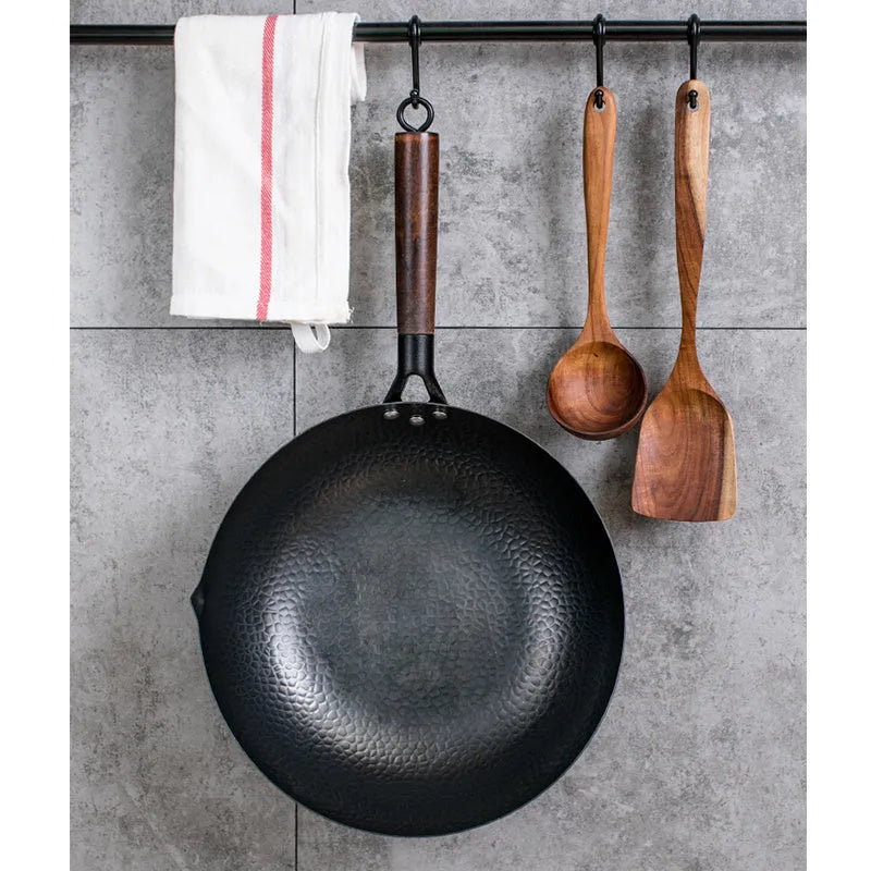 Traditional black iron wok with wooden handle showing 40cm diameter cooking surface