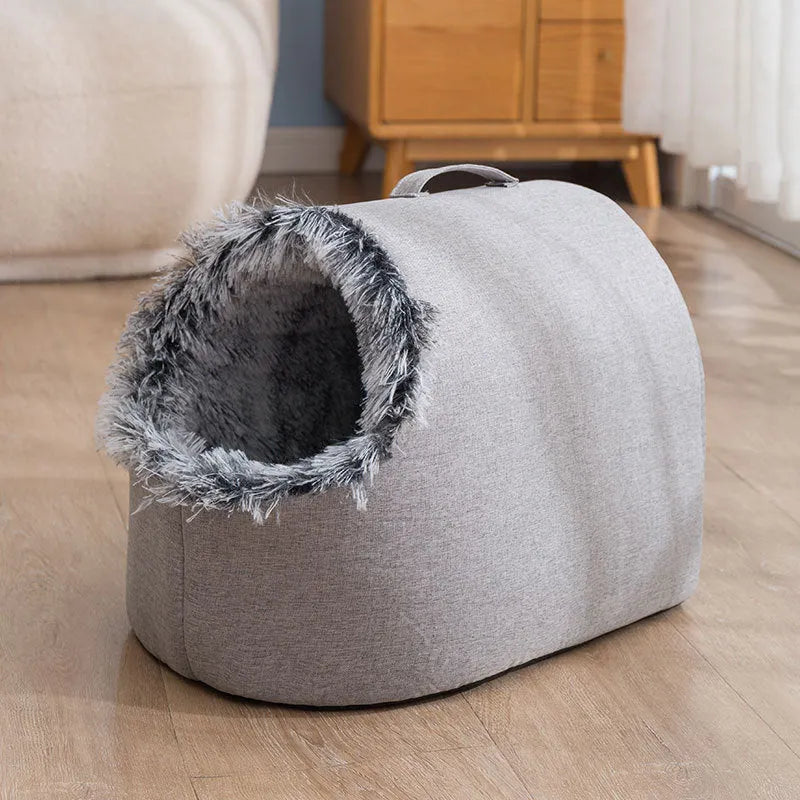 Grey fleece-lined enclosed cat sleeping bag nest showing closed design with warm interior