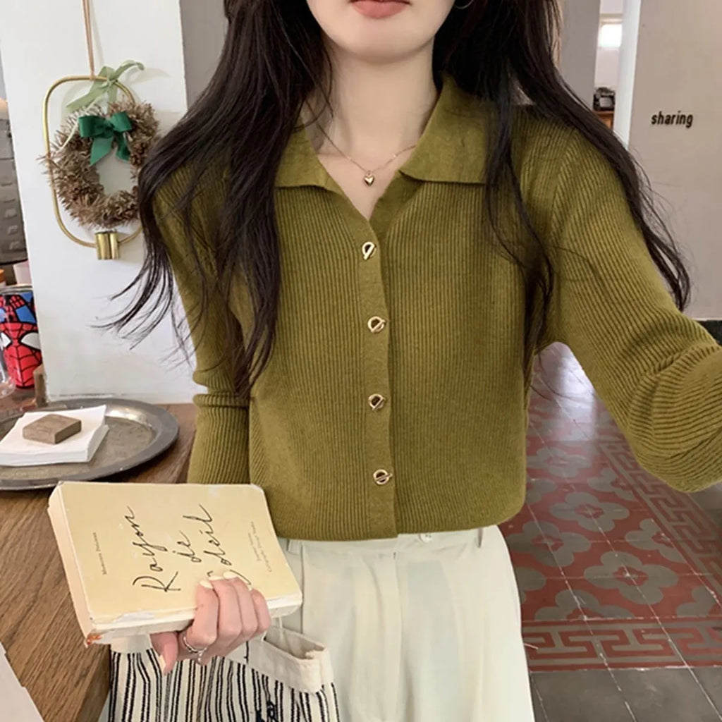 Women's beige knitted cardigan top with long sleeves shown open as a layering piece