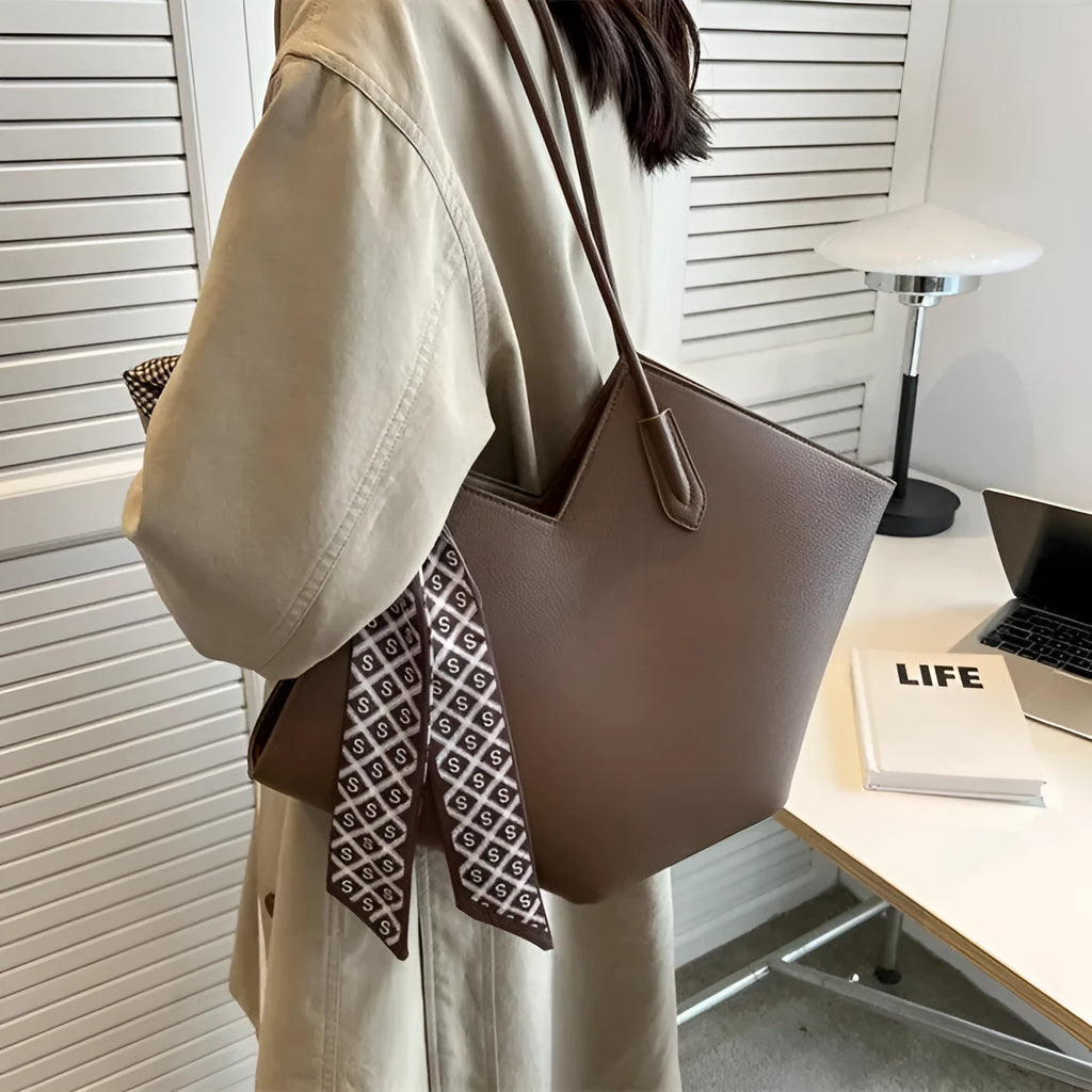 Women's large black PU leather shoulder bag with horizontal square shape and sandwich pocket.