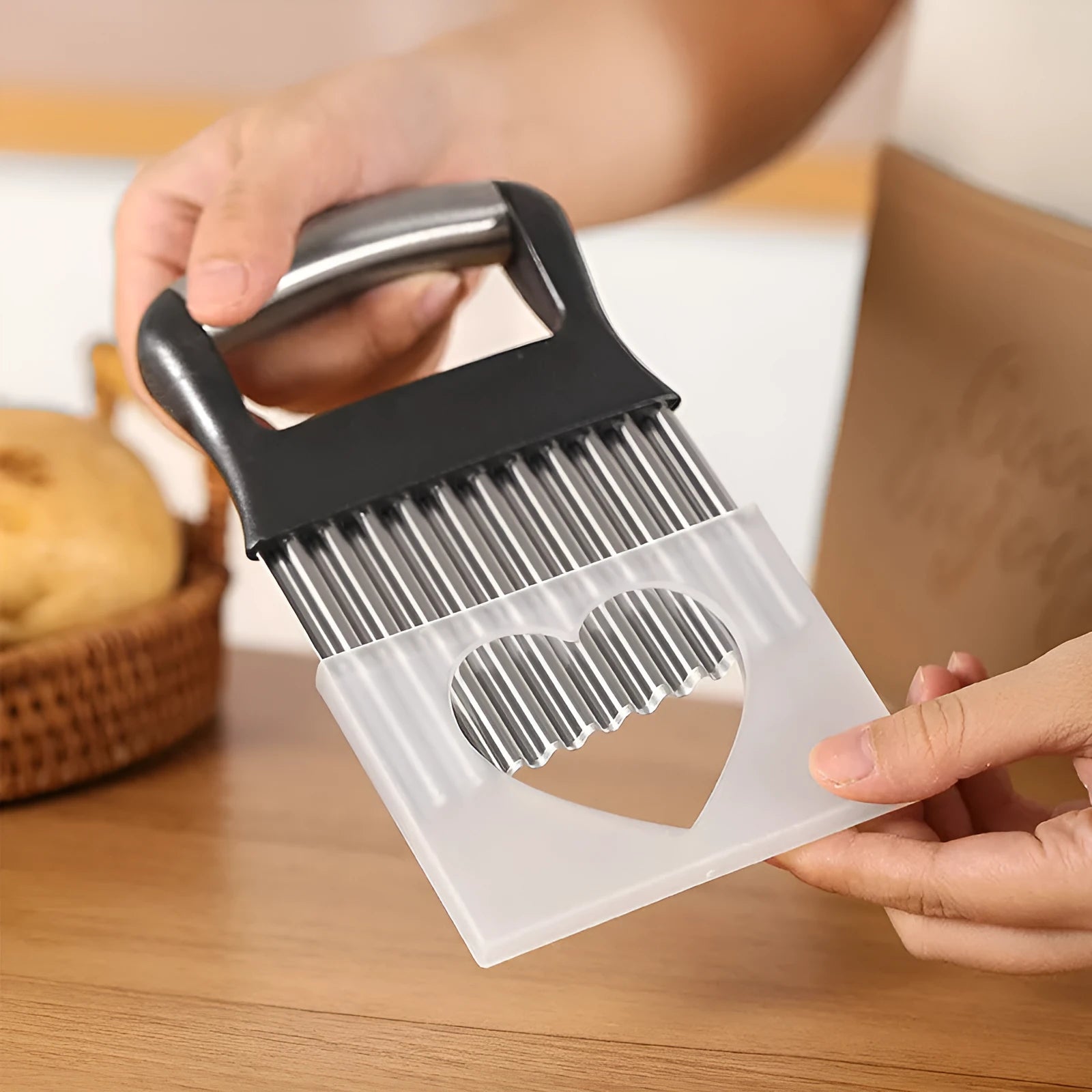 Stainless steel potato wave cutter knife with alloy handle on a cutting board.