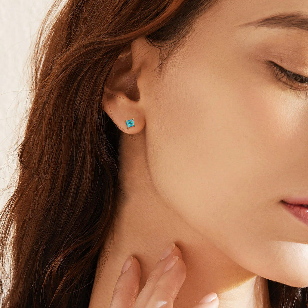 Gold-plated drop earrings with pear-shaped cubic zirconia stones in candy colours.
