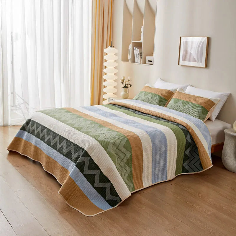 Pure cotton printed bed sheet set in a modern design on a bed, showing bedspread-style drape.