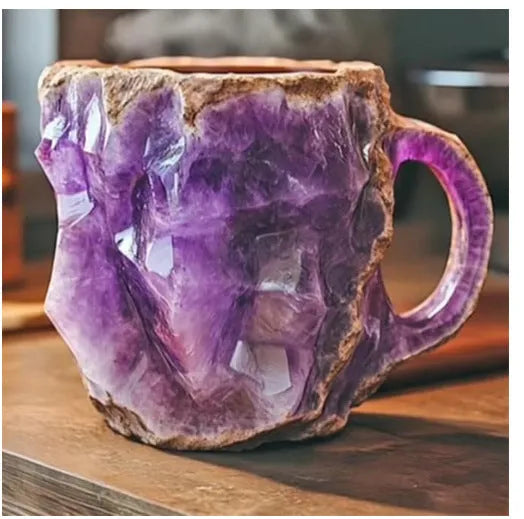 Purple resin coffee mug with handle showing crystal-like transparency on a table.