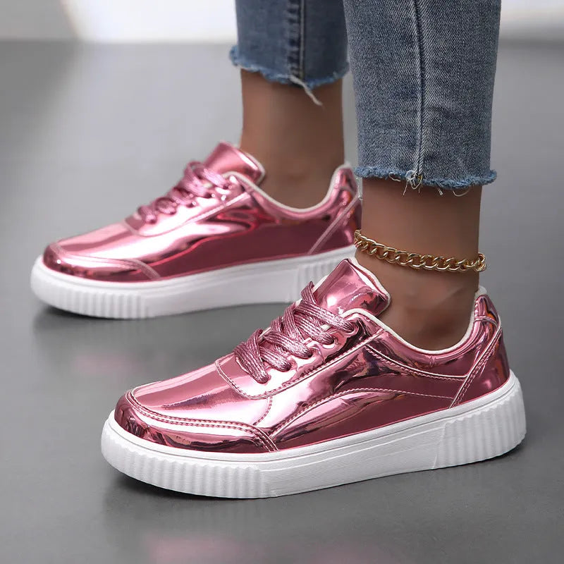 Rose gold sequin platform sneakers with round toe and thick sole.