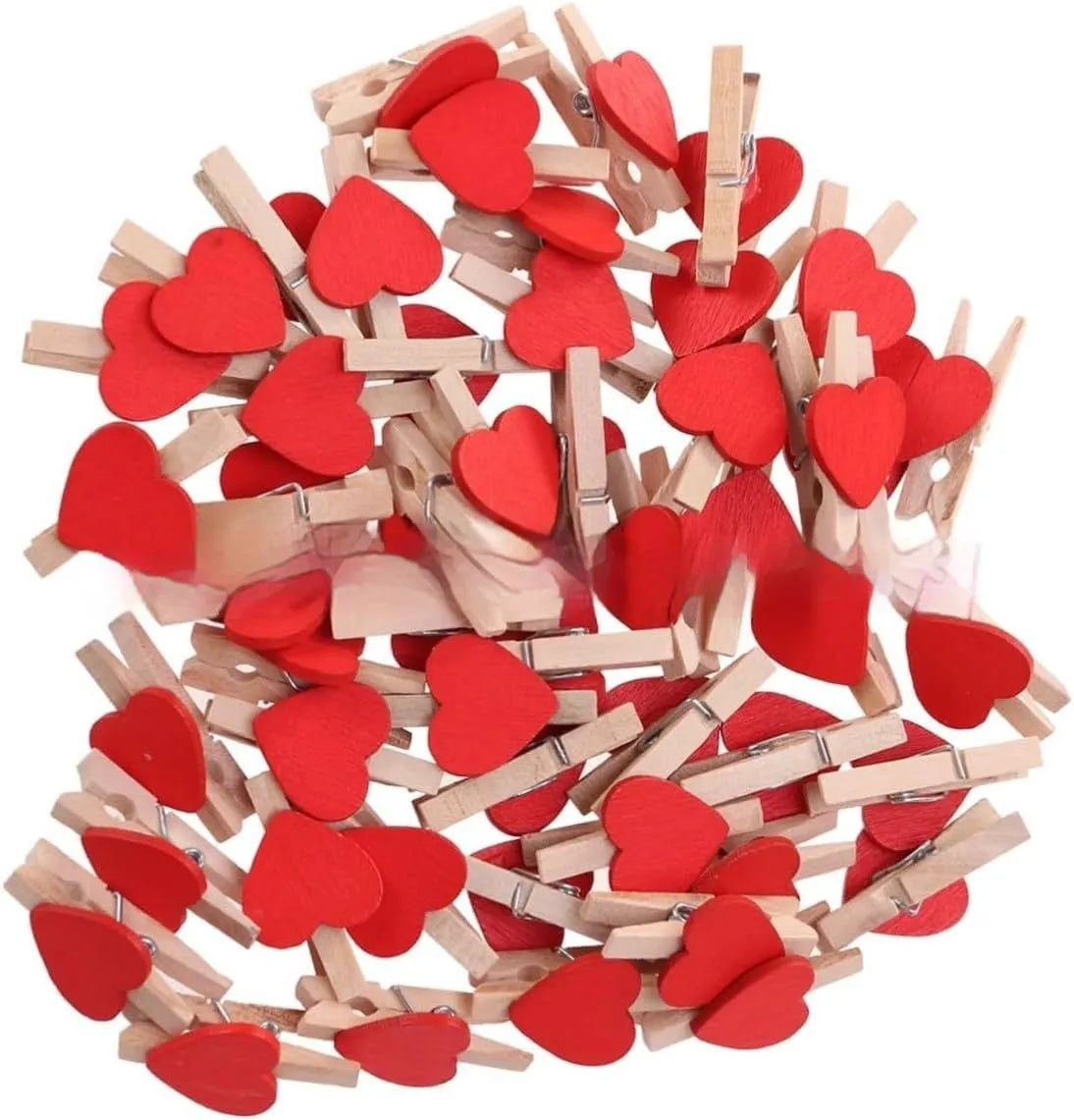 Five handmade wooden heart-shaped clips in red, white, and rose red on a surface.