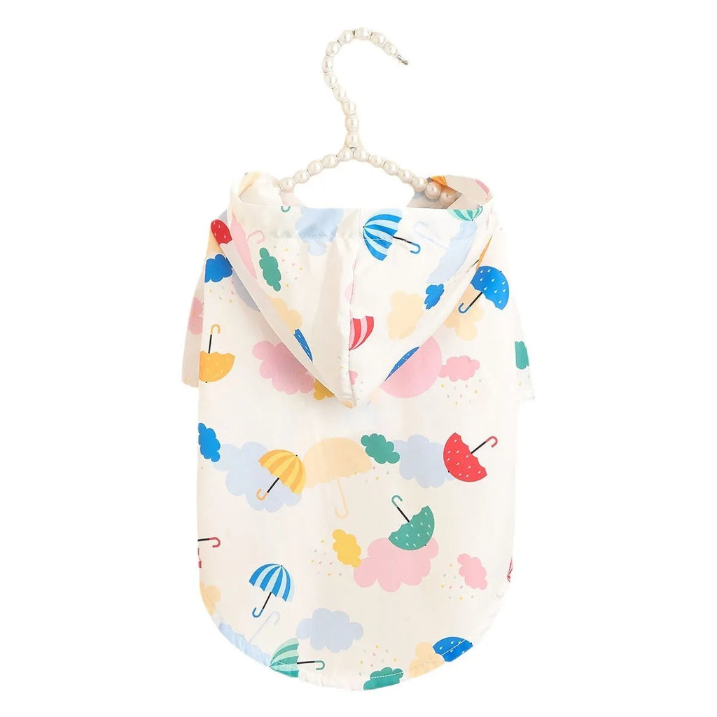 Colourful dog raincoat with a cartoon umbrella pattern, shown in size L on a mannequin.