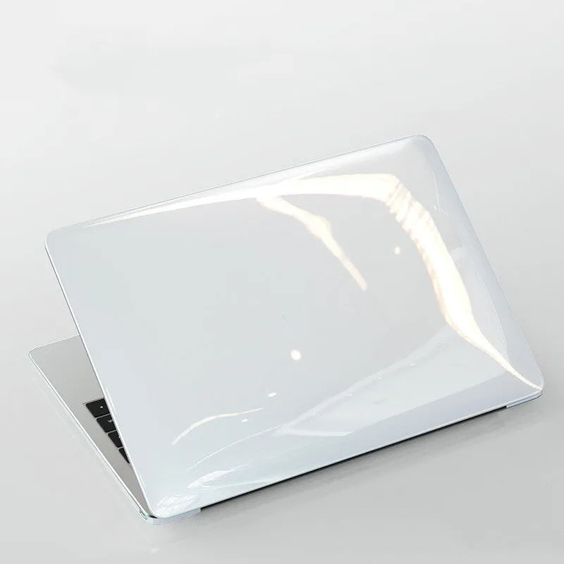 Transparent and black PC hard shell protective cases for a MacBook Pro 14-inch and 16-inch laptop.
