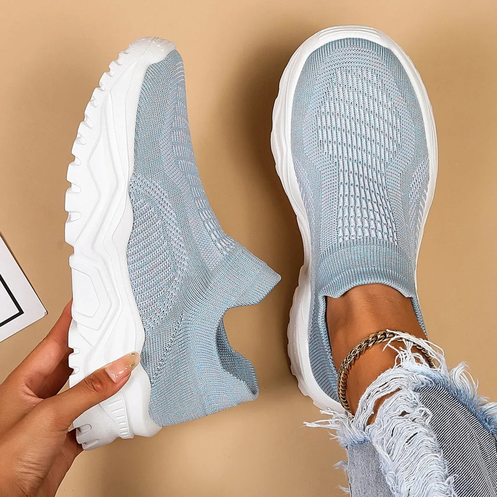 Light blue women's mesh slip-on sports shoes with woven upper and mid heel design