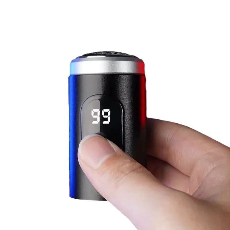 Black household mini portable rechargeable shaver with USB cable and cleaning brush on a white background.
