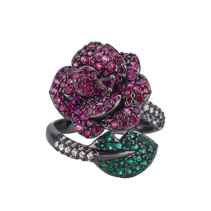 Geometric black gold flower ring with simulated red corundum centre stone