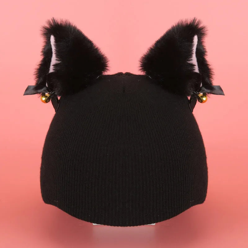 Plush cartoon-themed cover set on a medium motorcycle helmet with soft ear decorations.