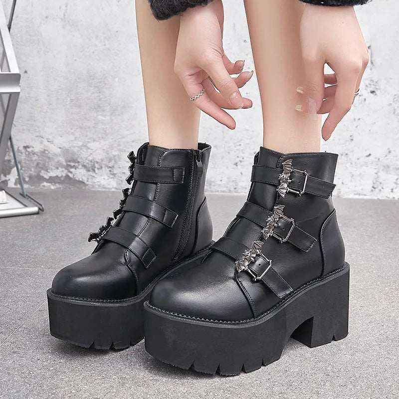 Black women's punk gothic ankle boots with bat buckle, side zipper, and chunky platform heel.