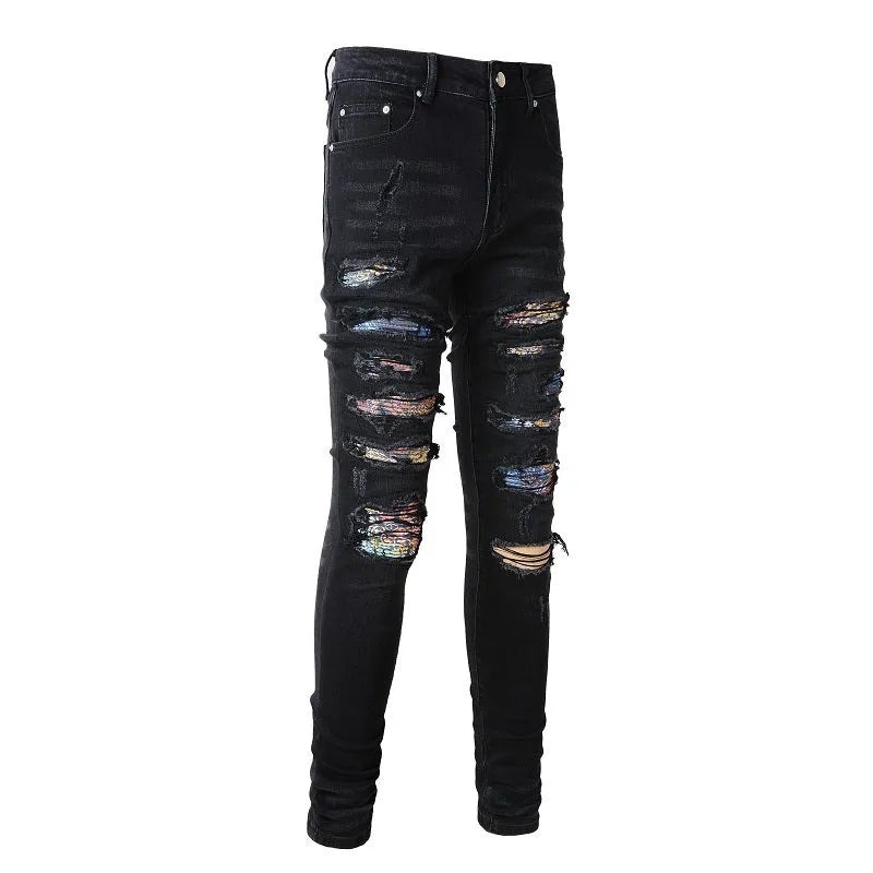 Men's black denim jeans with tattered hem and simple print patch detail