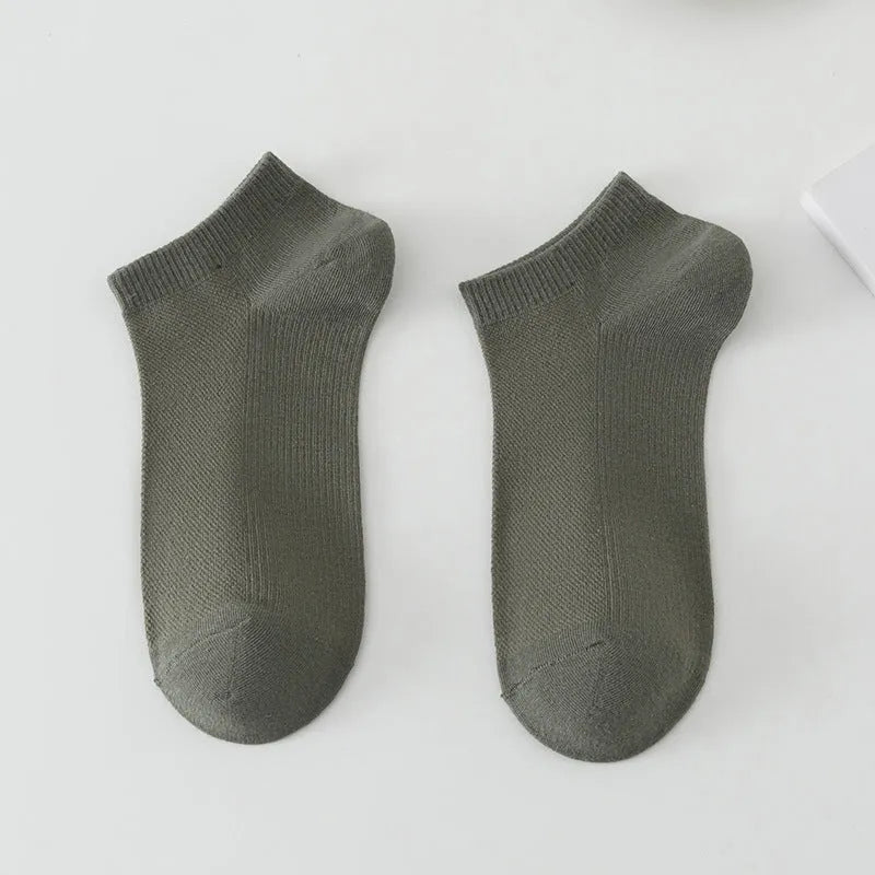 A pair of solid colour low-cut polyester boat socks laid flat, showcasing their simple design and one of the six available colour variants.