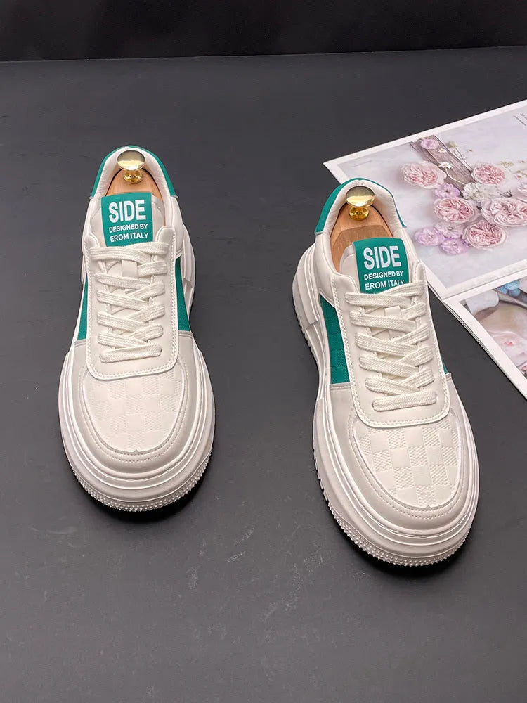 White leisure shoes with green or black detailing, cloth upper and rubber foam sole