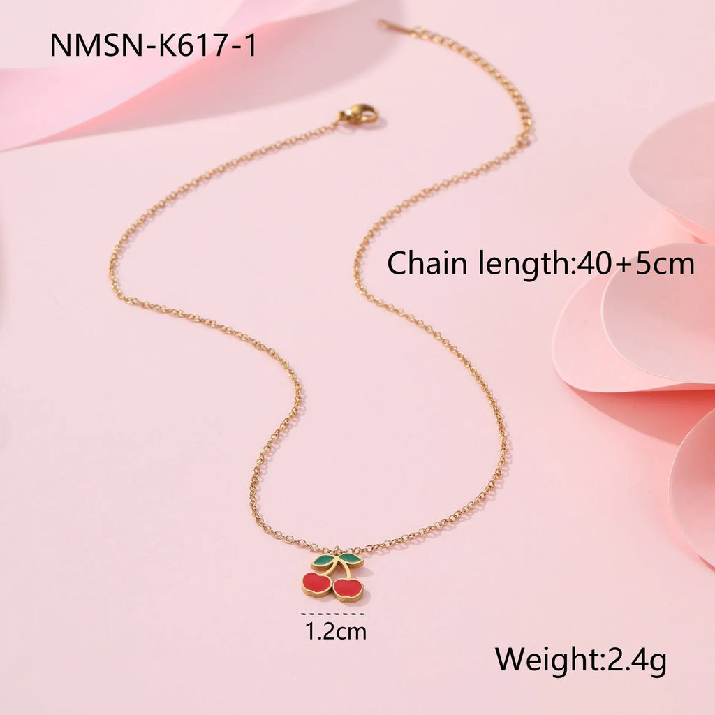 Stainless steel 18K gold plated cherry jewellery set showing necklace, bracelet, earrings, and ring.