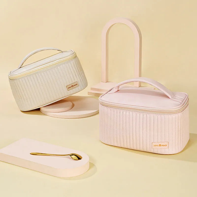 Open-top cake style women's makeup bag in PU leather showing solid colour options