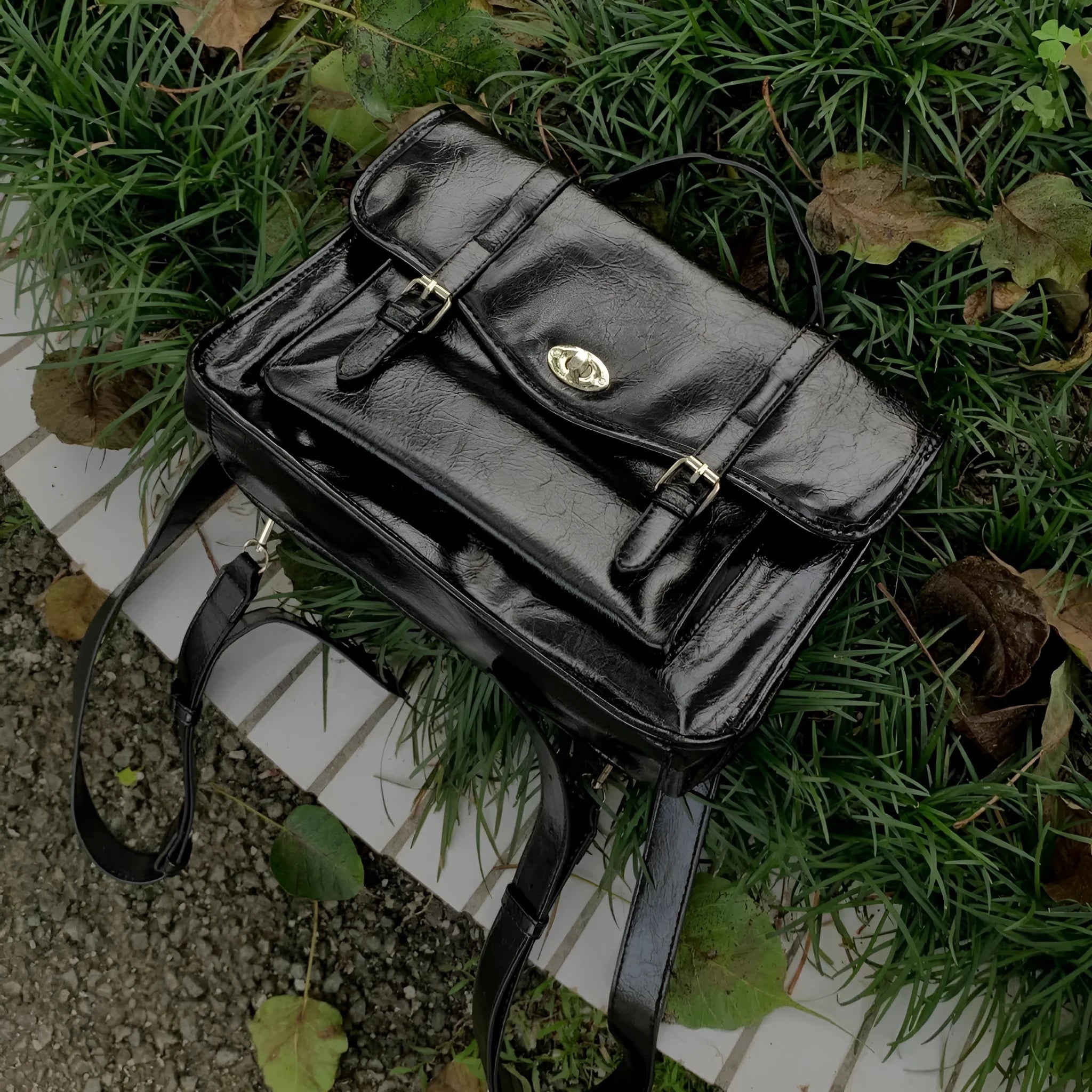 Black college messenger bag in oil wax leather style with shoulder strap