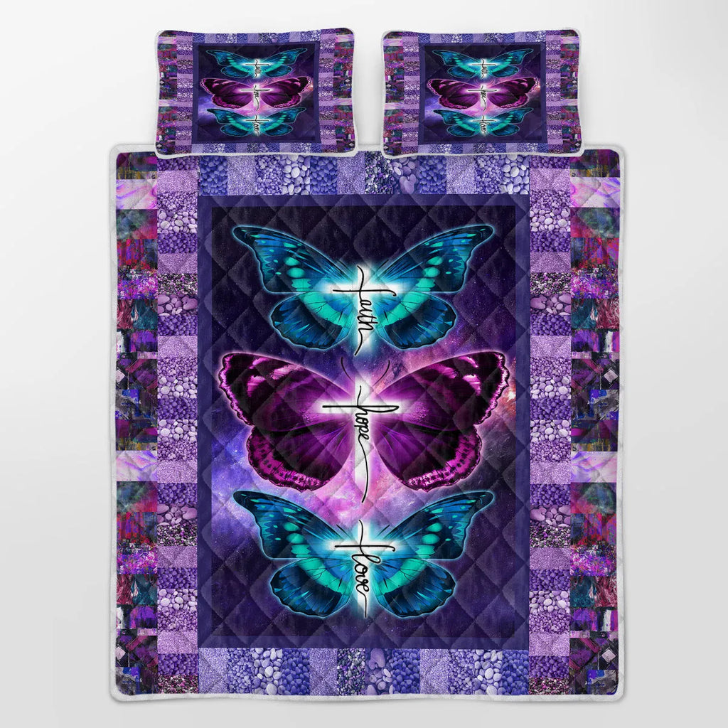 Purple butterfly patterned pet themed quilt set with two pillow shams on a bed