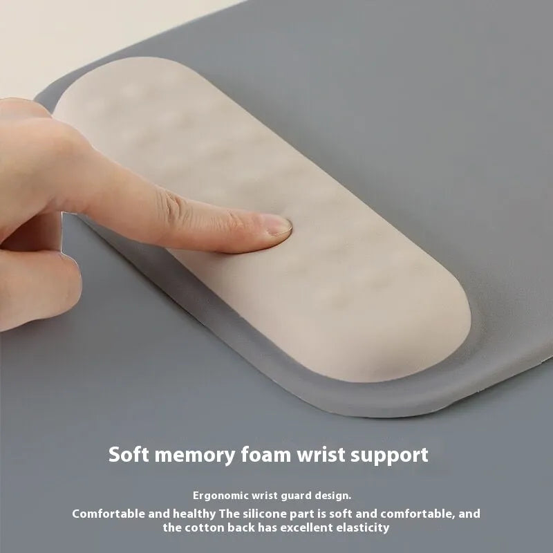Ergonomic mouse pad with raised wrist support in a choice of contrast colour patterns on a desk.