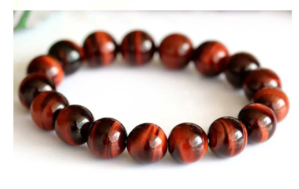 Handmade tiger's eye gemstone bracelet with lightning cat's eye pattern in geometric round beads