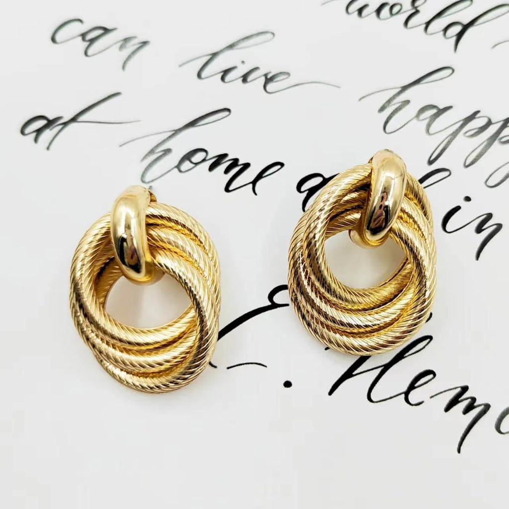 Gold geometric ring embossed twisted stud earrings with exaggerated creative design on metal