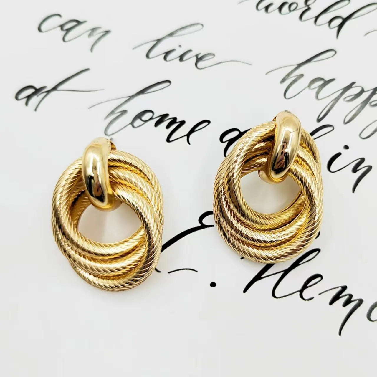 Gold geometric ring embossed twisted stud earrings with exaggerated creative design on metal
