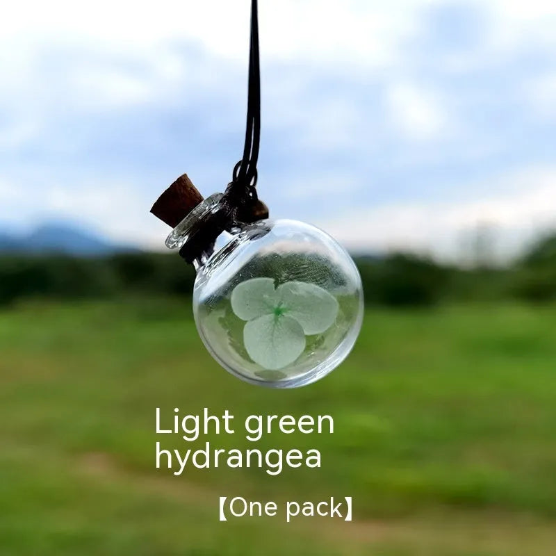 Glass car perfume pendant with preserved flowers in selected colour and diameter