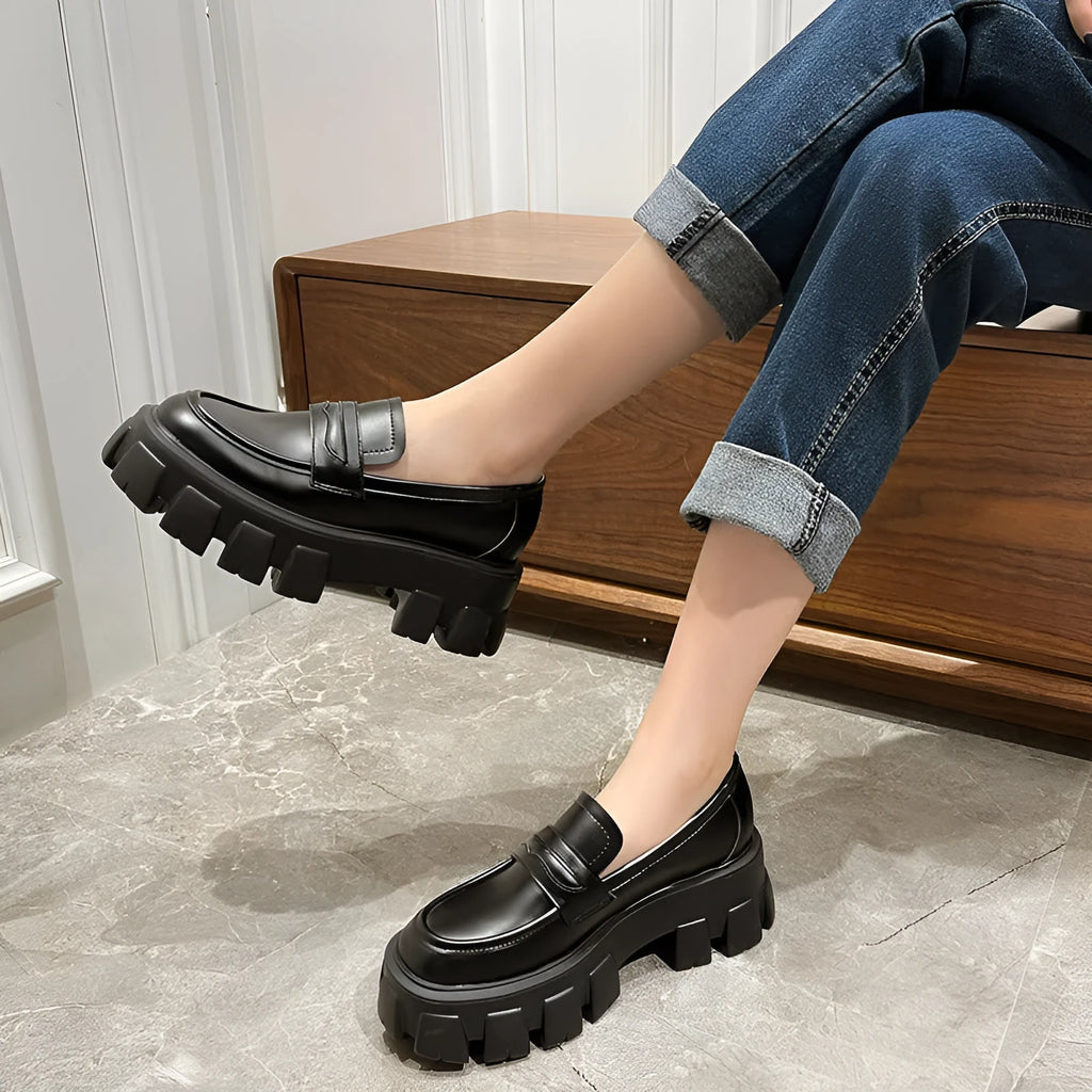 British style wide fit loafers with chunky rubber sole and muffin heel in patent leather.