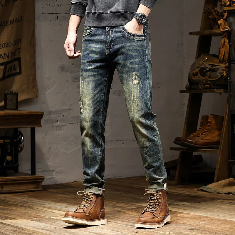 Men's skinny fit jeans in a retro blue wash with a zip fly closure.