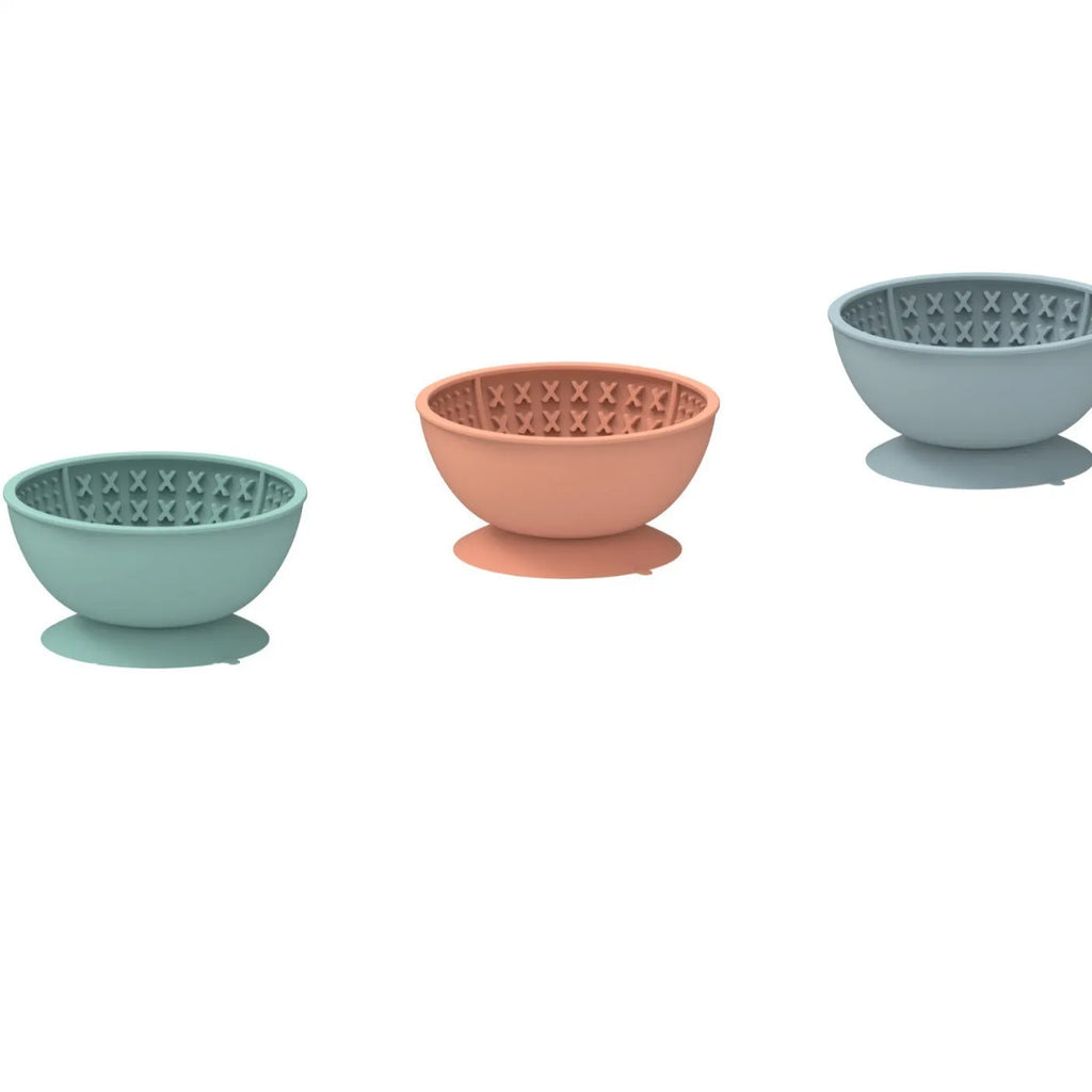 Cyan silicone pet licking mat bowl with suction cup base and textured feeding surface.