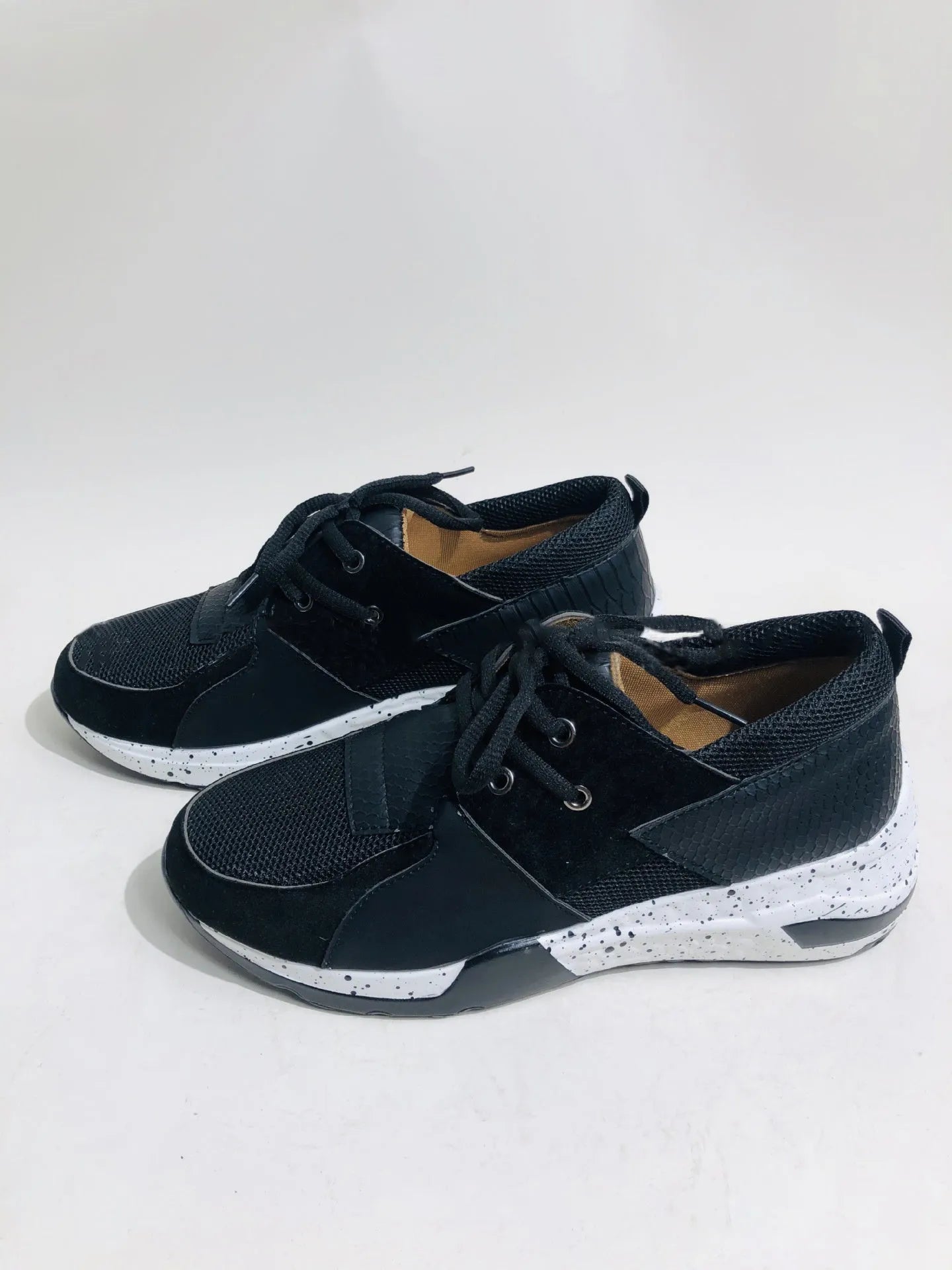 Women's suede casual sneakers with a wedge sole in leopard print colour.