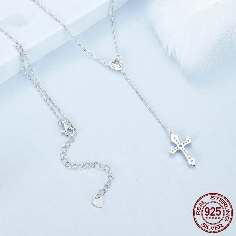 Silver love cross necklace on an O-ring chain with a V-neck design, colour BSN384.