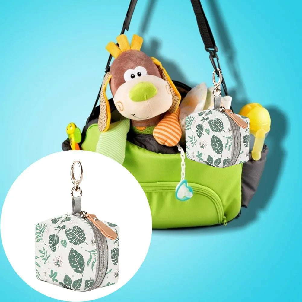Baby pacifier holder case in PU leather with impervious nylon lining and buckle clip, holds 2 pacifiers, compact 6.35cm size