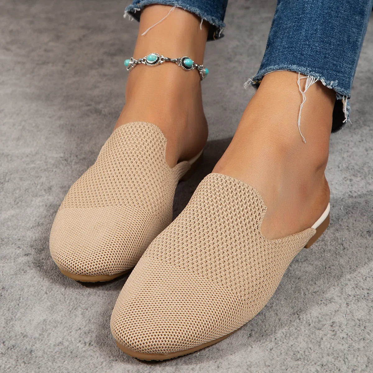 Apricot coloured casual mesh slip-on sandals with a round toe and flat rubber sole.