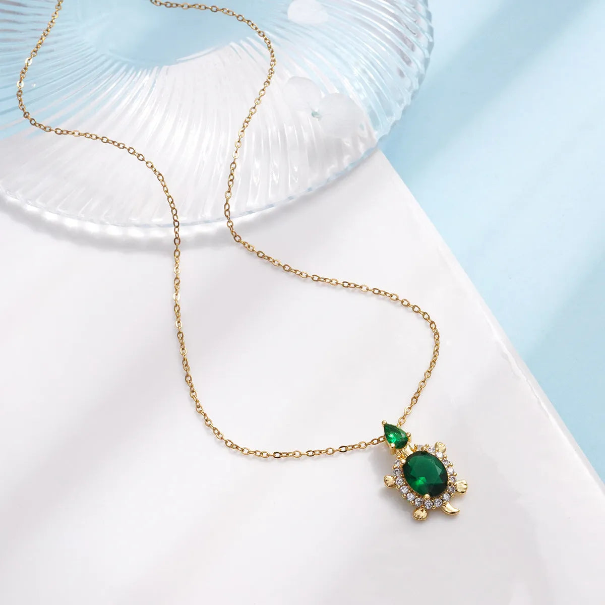 Gold-plated copper sea turtle pendant necklace with mixed gemstone inlay and zirconium encrustation on titanium steel chain