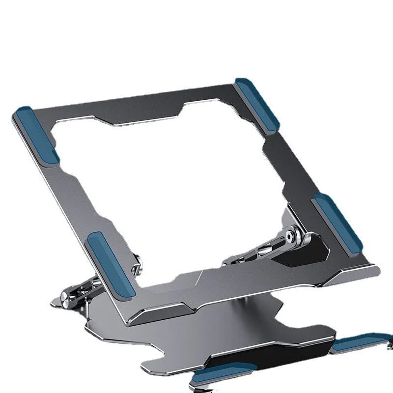 Grey portable aluminum laptop stand shown folded and in use with a silver laptop, demonstrating its adjustable angle.