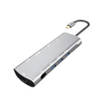 Grey aluminium USB-C docking station showing HDMI, VGA, USB, PD charging, and SD card ports.