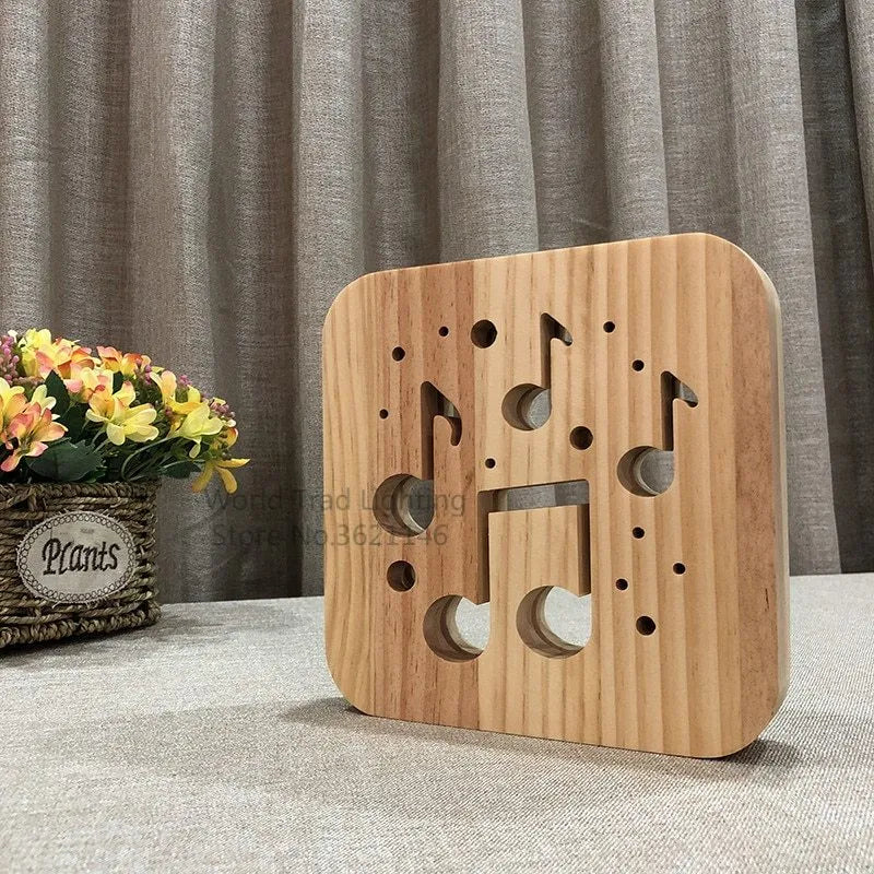 Pine wood cube LED atmosphere lamp with warm white glow, shown with USB cable.