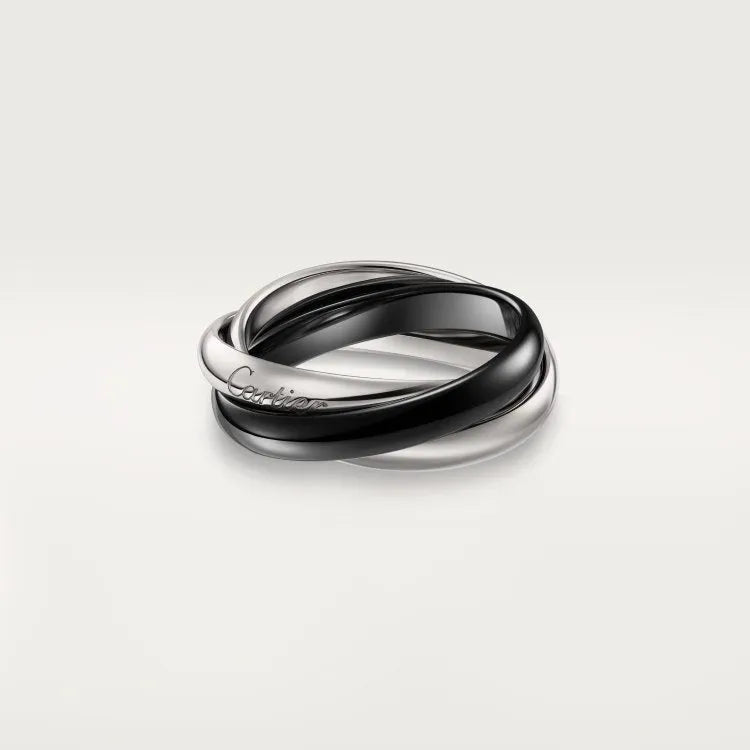 Geometric U-shaped sterling silver couple ring with full diamond pavé setting on a black background.