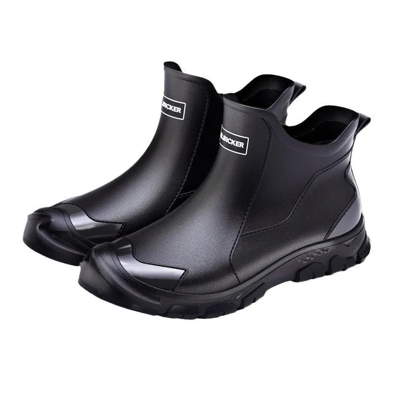 Short tube PVC rain boot in black and red with round toe and flat non-slip sole.