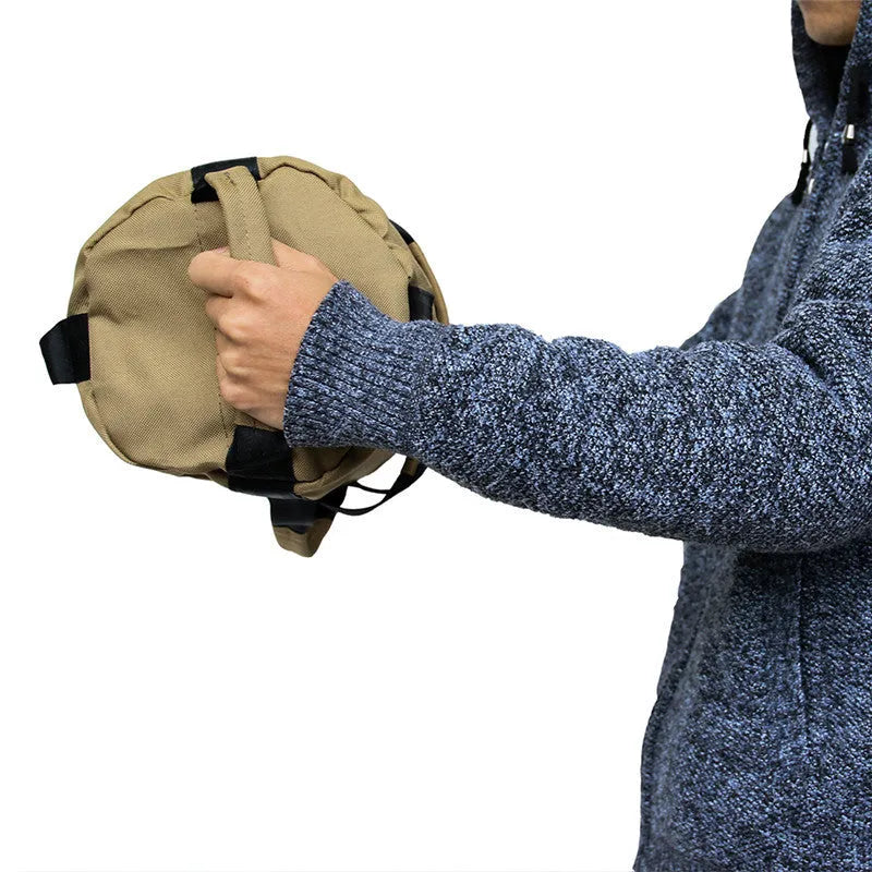 Black weightlifting sandbag with 6 handles, 900D Oxford cloth, 48cm, sitting on a gym floor.