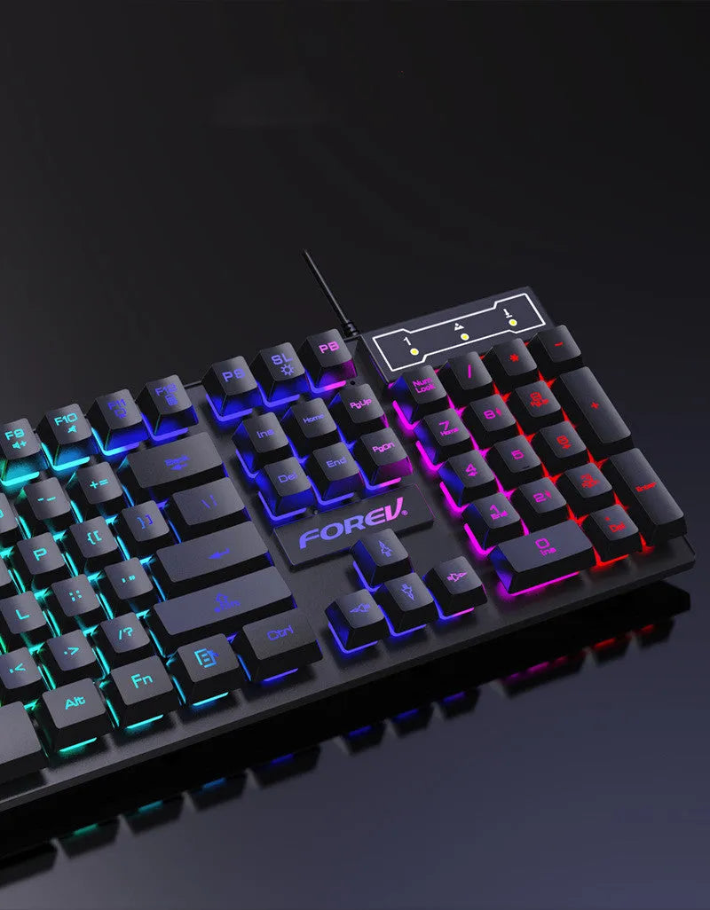 Four piece wired computer accessory set with keyboard, mouse, earphone, and mouse pad on a desk